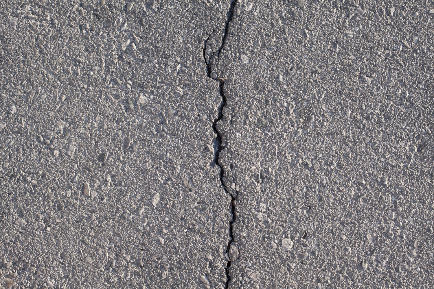 Crack filling on an asphalt driveway